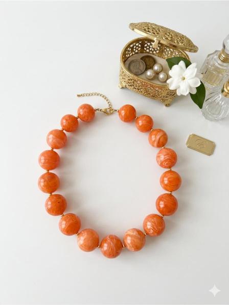 collar bolas naranjas